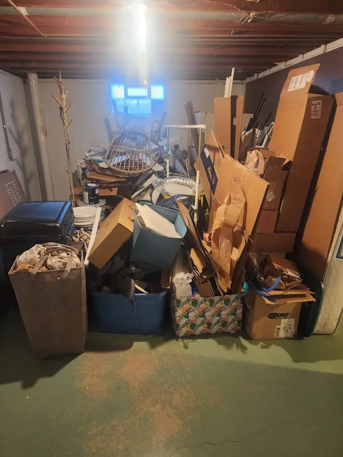 Roll-off dumpster container at job site for 6 Yard Dumpster Rental in Mills